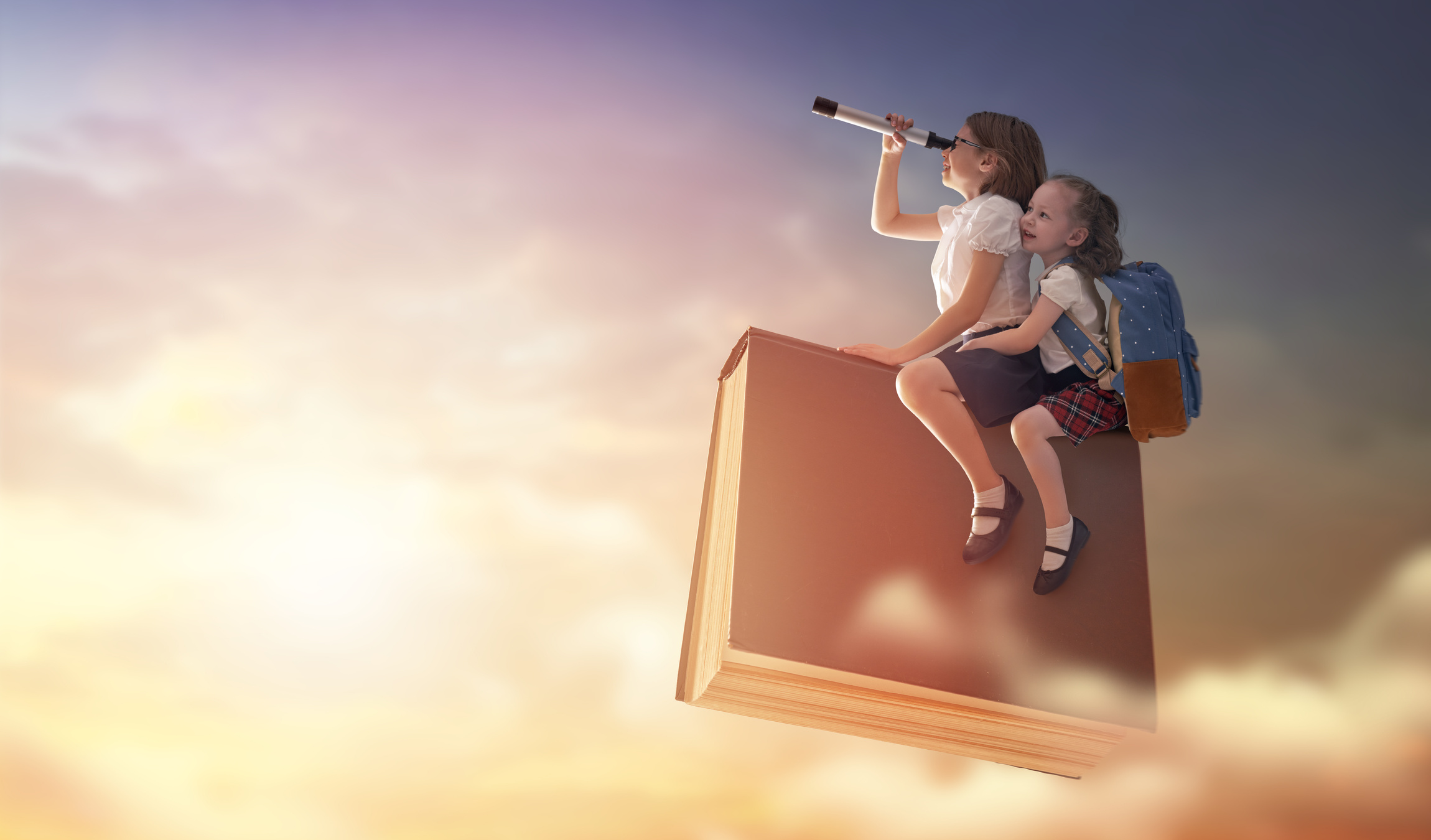 children flying on the book